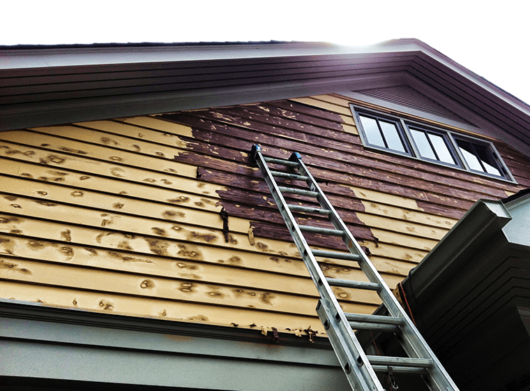 Damaged wood showcasing the need for a fresh coat of paint on your home's exterior.